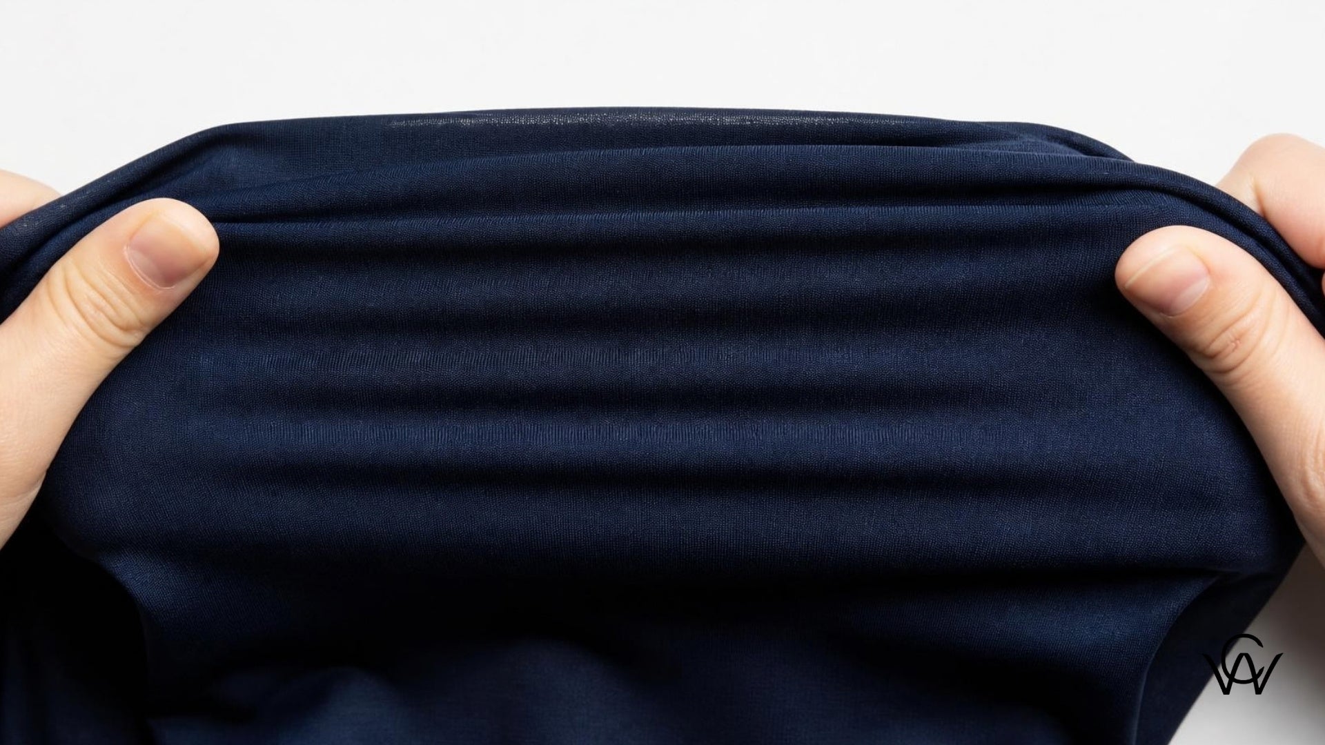 Poly knit fabric stretched to show elasticity - Clothwala fabric photography