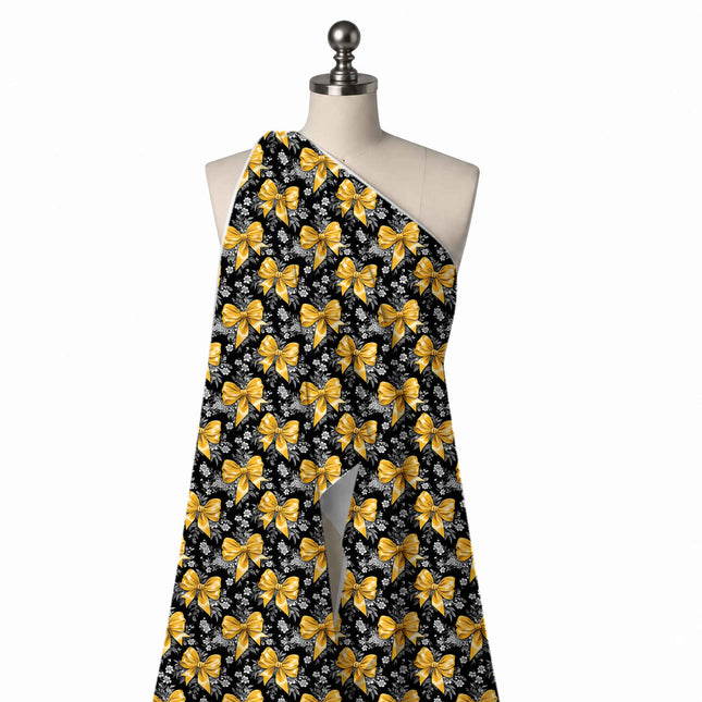 Draped on a mannequin: half-drop repeat of medium glossy yellow satin bows with tails, design Design No_4432, Clothwala