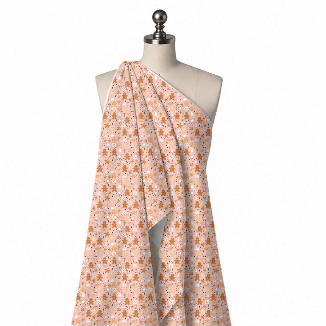 Draped on a mannequin: scattered flat-colour print of caramel brown gingerbread men, design Design No_4896, Clothwala