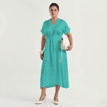 Bright Aqua polka dot fabric for dresses — draped on the roll