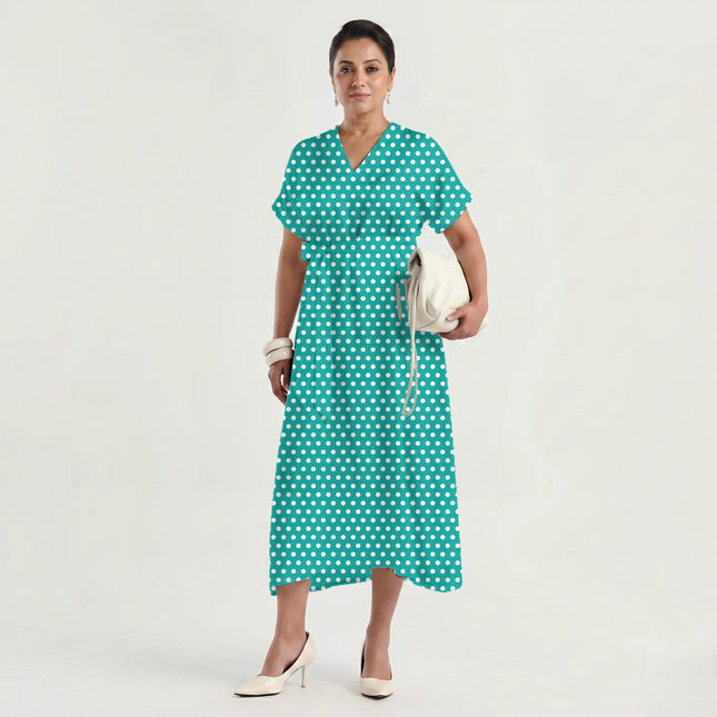 Bright Aqua polka dot fabric for dresses — draped on the roll