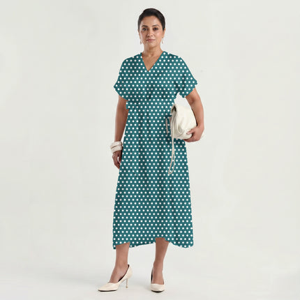 Deep Teal polka dot fabric for dresses — draped on the roll