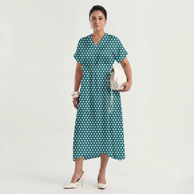 Deep Teal polka dot fabric for dresses — draped on the roll
