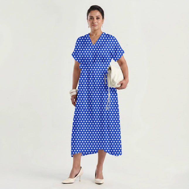 Luminous Cobalt polka dot fabric for dresses — draped on the roll