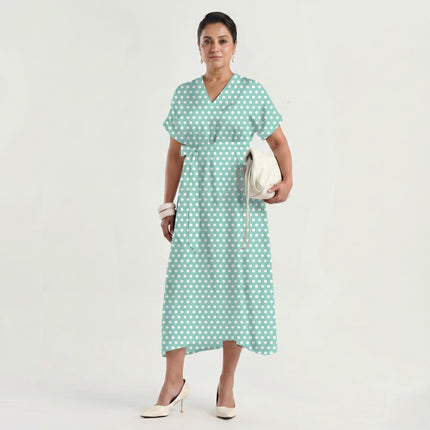 Soft Seafoam polka dot fabric for dresses — draped on the roll