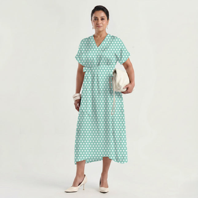 Soft Seafoam polka dot fabric for dresses — draped on the roll