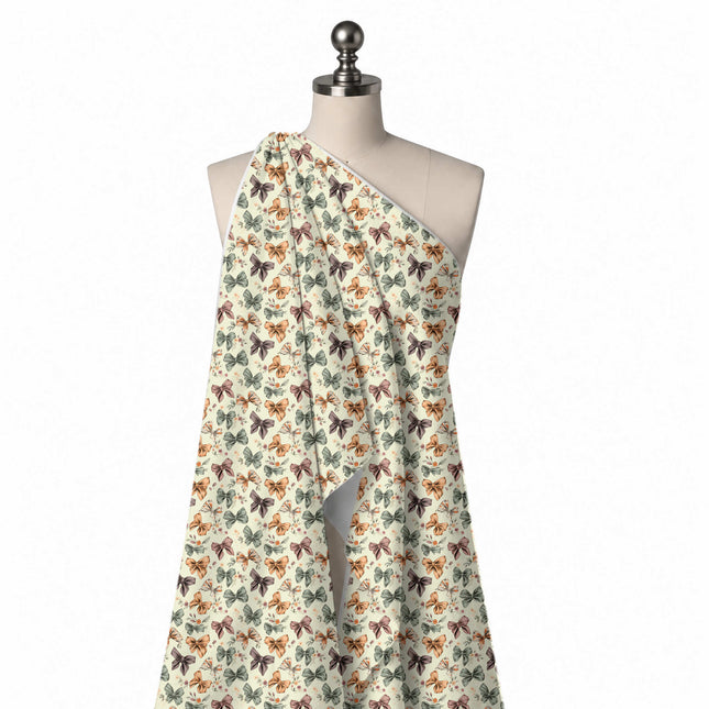 Draped on a mannequin: dense tossed layout of small outlined bows in mustard orange, design Design No_4407, Clothwala
