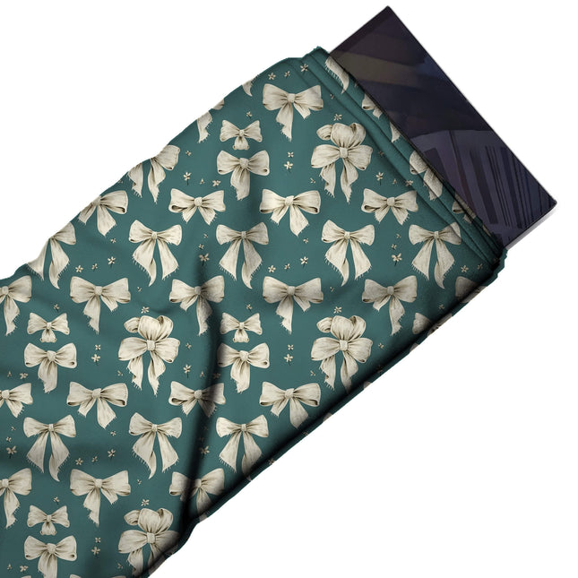 Flat fabric swatch: dense upright all-over layout of small cream bows with brown line, design Design No_4439, Clothwala