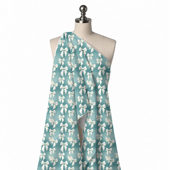 Draped on a mannequin: vertical columns of medium to large white satin-look bows with long, design Design No_4453, Clothwala