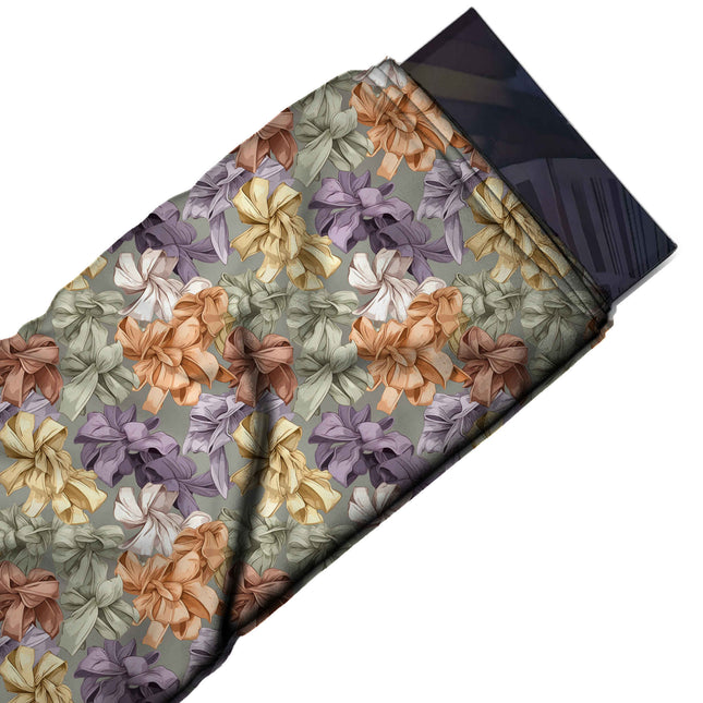 Flat fabric swatch: dense all-over print of multi-loop ribbon rosettes with shaded folds, design Design No_4404, Clothwala