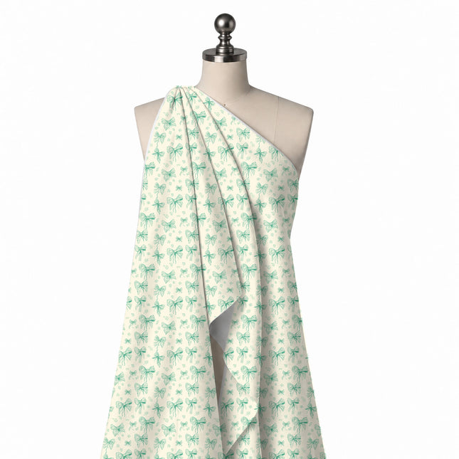 Draped on a mannequin: all-over layout of small to medium bows in single-colour mint green, design Design No_4449, Clothwala