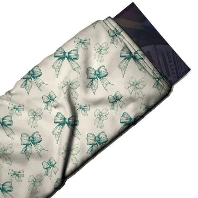 Flat fabric swatch: tonal all-over print of medium and small bows in etched teal green, design Design No_4435, Clothwala