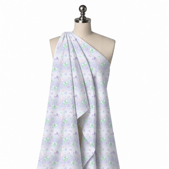 Draped on a mannequin: scattered small to medium bows in mint green, violet, design Design No_4417, Clothwala
