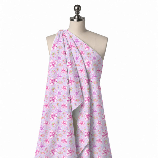 Draped on a mannequin: all-over layout of large shaded pink and lilac satin bows with, design Design No_4460, Clothwala