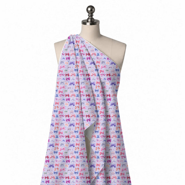 Draped on a mannequin: small-scale rows of satin-look bows in pink, magenta, design Design No_4462, Clothwala