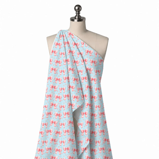 Draped on a mannequin: regular spaced layout of coral pink and white candy-striped bows in, design Design No_4871, Clothwala