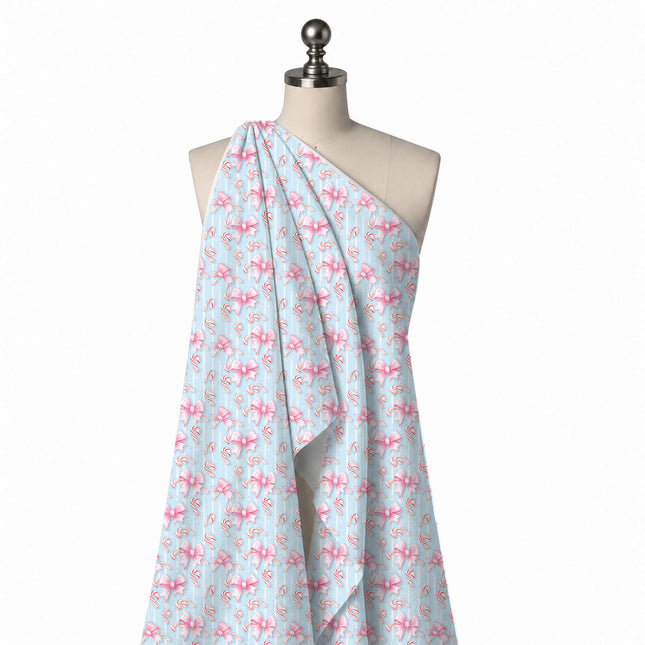 Draped on a mannequin: all-over layout of shaded pink ribbon bows with notched tails and, design Design No_4879, Clothwala