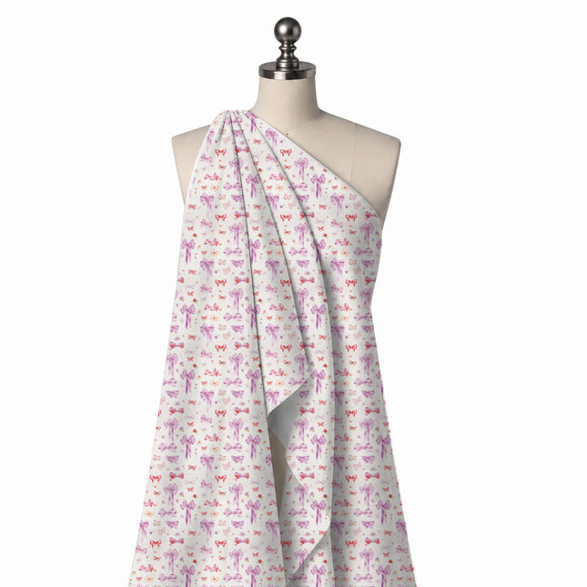Draped on a mannequin: small-scale scattered print of lilac and pink satin bows with long, design Design No_4456, Clothwala