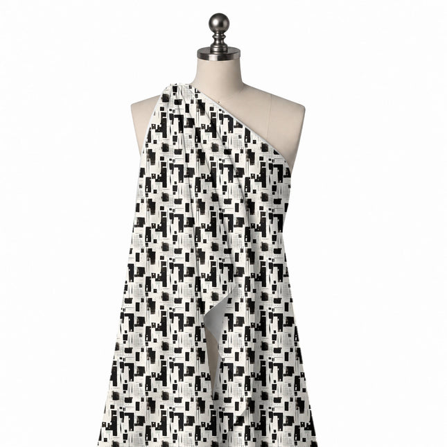 Draped on a mannequin: all-over monochrome abstract of hand-cut black rectangles, design Design No_4072, Clothwala