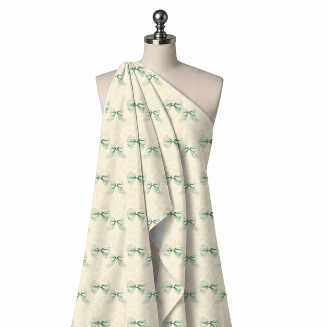 Draped on a mannequin: widely spaced repeat of paired mint green bows with a white, design Design No_4436, Clothwala