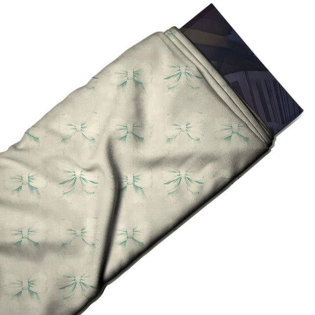 Flat fabric swatch: grid repeat of medium off-white bows rendered tone-on-tone with soft, design Design No_4447, Clothwala
