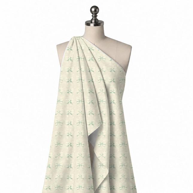 Draped on a mannequin: grid repeat of medium off-white bows rendered tone-on-tone with, design Design No_4447, Clothwala