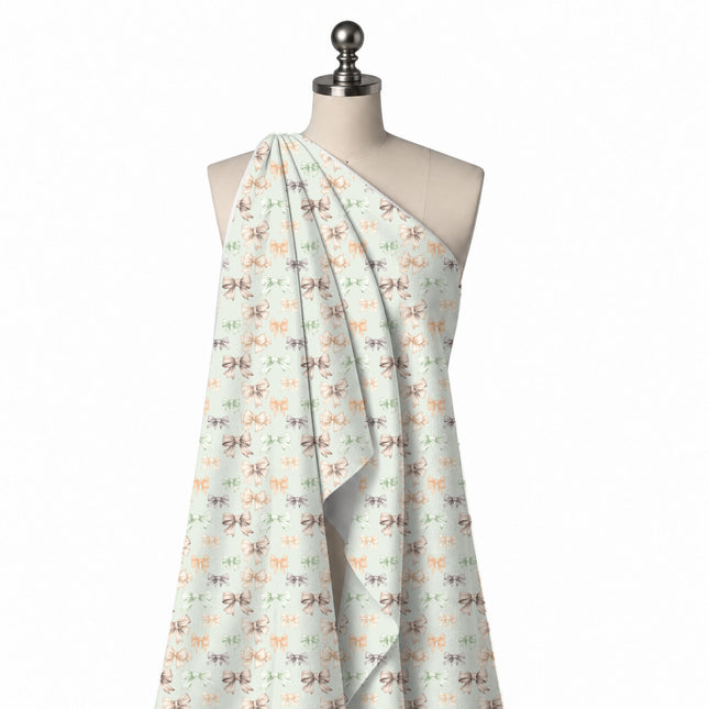 Draped on a mannequin: spaced all-over layout of medium and small finely line-shaded bows, design Design No_4401, Clothwala