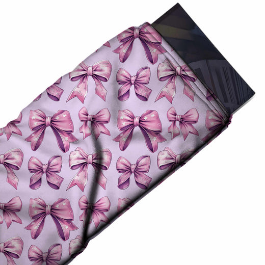 Flat fabric swatch: horizontal rows of large mauve pink bows with plum shading and small, design Design No_4459, Clothwala
