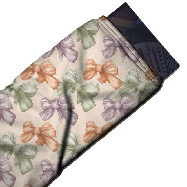 Flat fabric swatch: bold repeat of large softly shaded bows in sage green, design Design No_4406, Clothwala