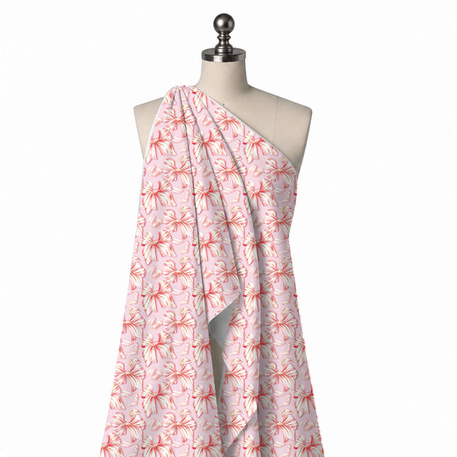 Draped on a mannequin: large-scale half-drop layout of shaded pink and white striped bows, design Design No_4883, Clothwala