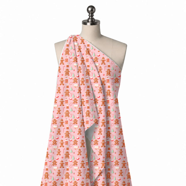 Draped on a mannequin: medium-scale one-way festive print of shaded brown gingerbread men, design Design No_4902, Clothwala