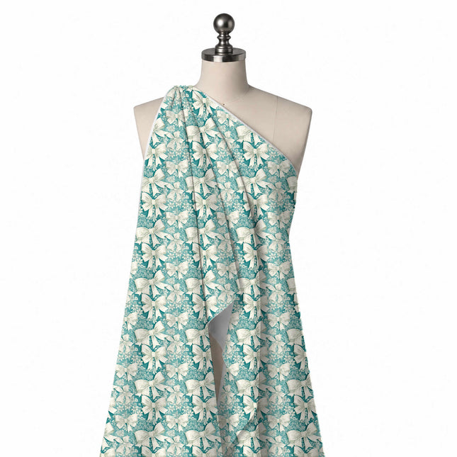 Draped on a mannequin: closely packed all-over layout of large cream bows with textured, design Design No_4446, Clothwala