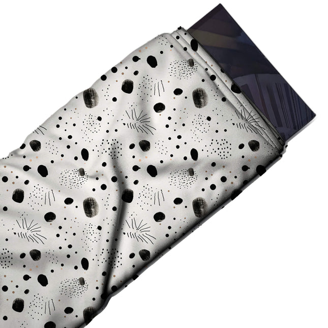 Flat fabric swatch: tossed scatter of hand-painted black blobs with dry-brush texture, design Design No_4036, Clothwala