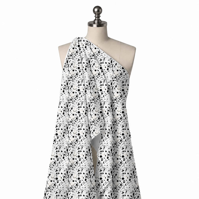 Draped on a mannequin: heavy-coverage all-over splatter of black ink drops from fine, design Design No_4047, Clothwala