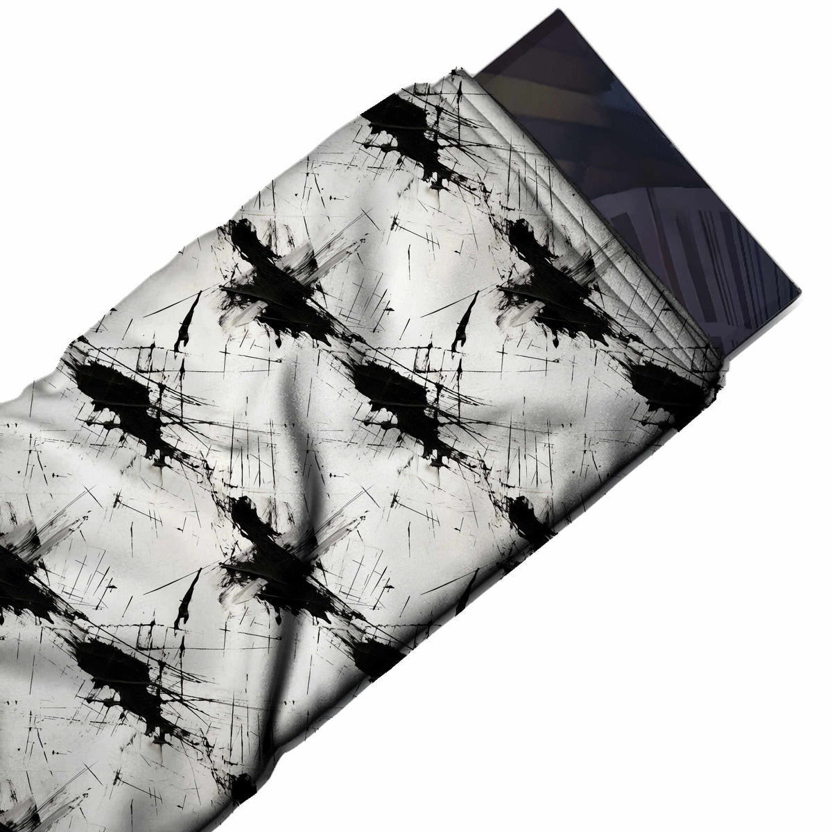 Flat fabric swatch: spaced repeat of large black ink splatters running on a diagonal, design Design No_3994, Clothwala