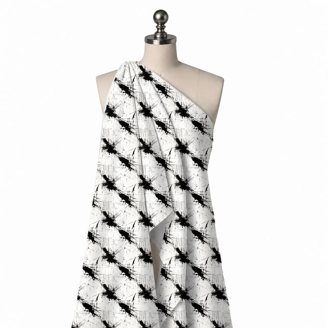 Draped on a mannequin: spaced repeat of large black ink splatters running on a diagonal, design Design No_3994, Clothwala