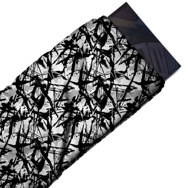 Flat fabric swatch: dense all-over tangle of flat black drip strokes and splatters in, design Design No_4002, Clothwala