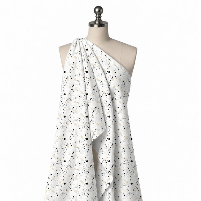 Draped on a mannequin: open all-over splatter print of small black ink drops and fine, design Design No_4042, Clothwala