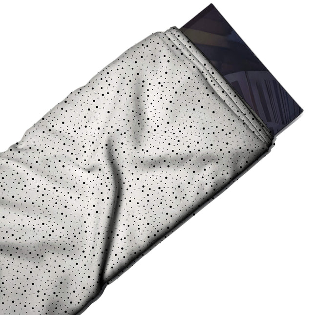 Flat fabric swatch: even all-over micro print of tiny black pin dots in two or three, design Design No_4045, Clothwala
