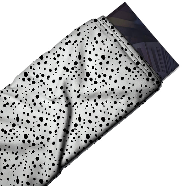 Flat fabric swatch: tossed all-over scatter of flat black oval and round spots in mixed, design Design No_4031, Clothwala