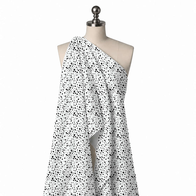Draped on a mannequin: tossed all-over scatter of flat black oval and round spots in mixed, design Design No_4031, Clothwala