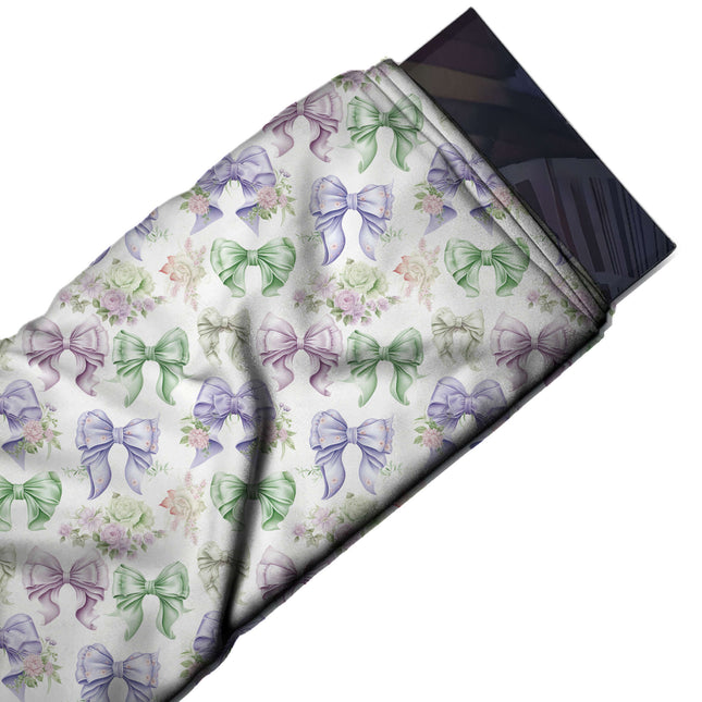 Flat fabric swatch: medium-scale watercolour bows with frilled edges and short tails in, design Design No_4427, Clothwala