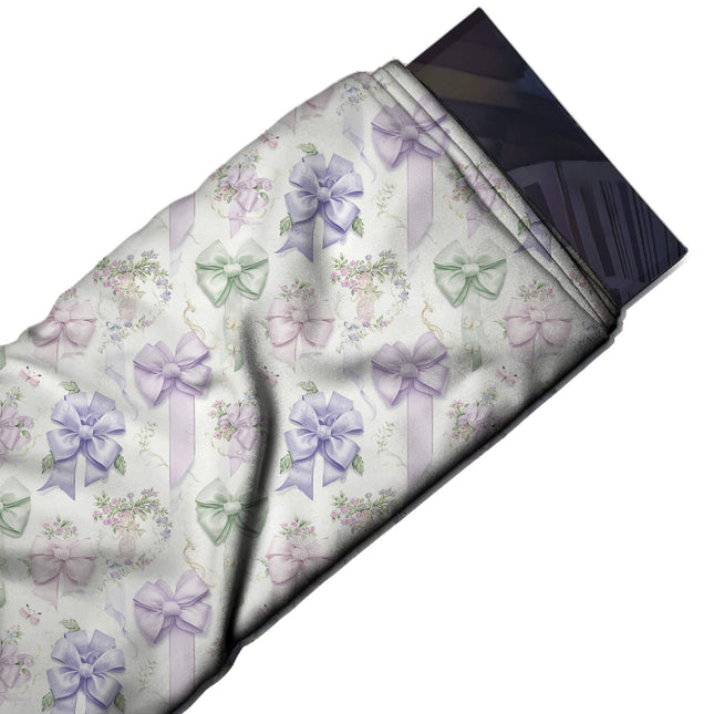 Flat fabric swatch: medium-scale shaded satin bows in lilac, lavender, design Design No_4423, Clothwala