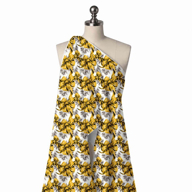 Draped on a mannequin: large-scale print of mustard yellow bows with heavy black, design Design No_4430, Clothwala