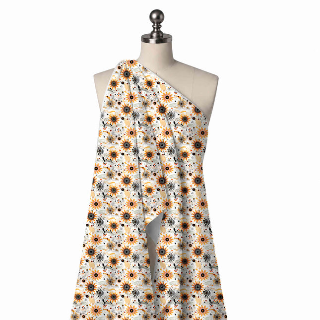 Draped on a mannequin: tossed all-over floral of small to medium orange daisies with black, design Design No_4385, Clothwala