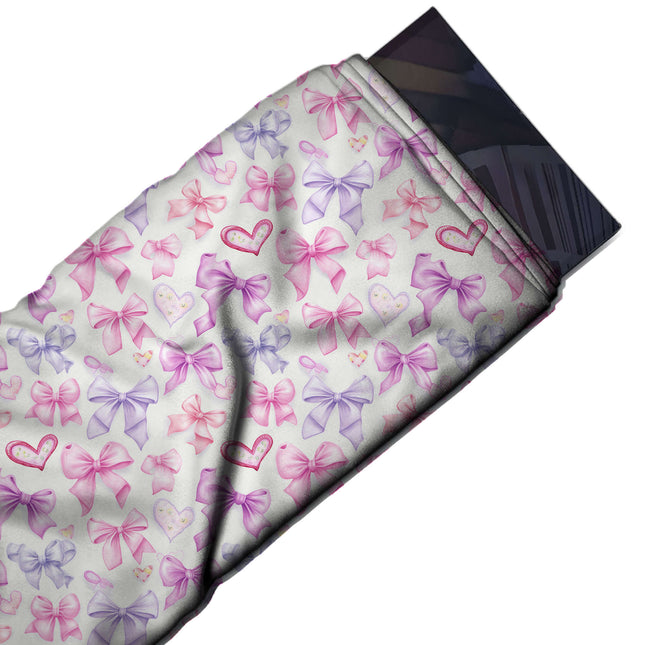 Flat fabric swatch: all-over layout of medium soft-shaded bows in pink, design Design No_4463, Clothwala