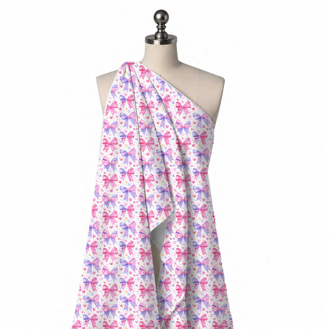 Draped on a mannequin: all-over layout of large bows split between pink and periwinkle, design Design No_4473, Clothwala