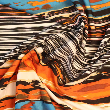 SOFT FEEL POLY CREPE ZEBRA BLACK ORANGE PRINT